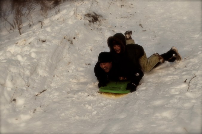 M & G sledding down the big hill